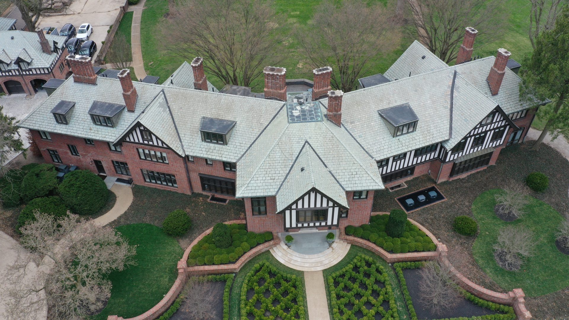 Tudor mansion slate roof restored to original beauty after professional gentle cleaning by Forza Roof Cleaning