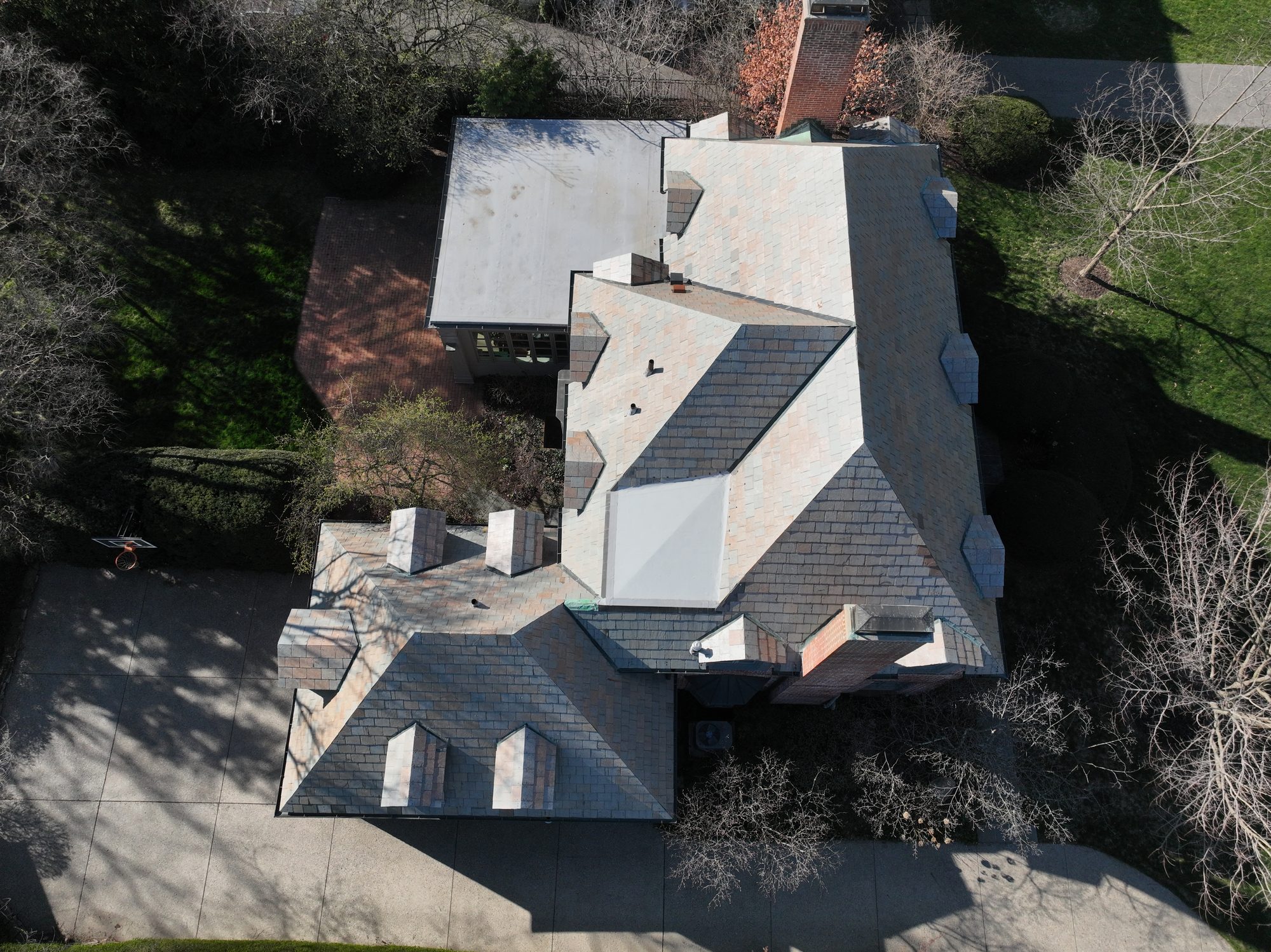 Side view of Bexley Colonial home slate roof after Forza gentle cleaning