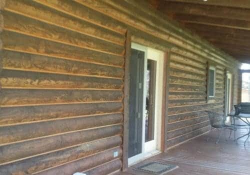 Wood siding blackened with mold and algae before treatmenting