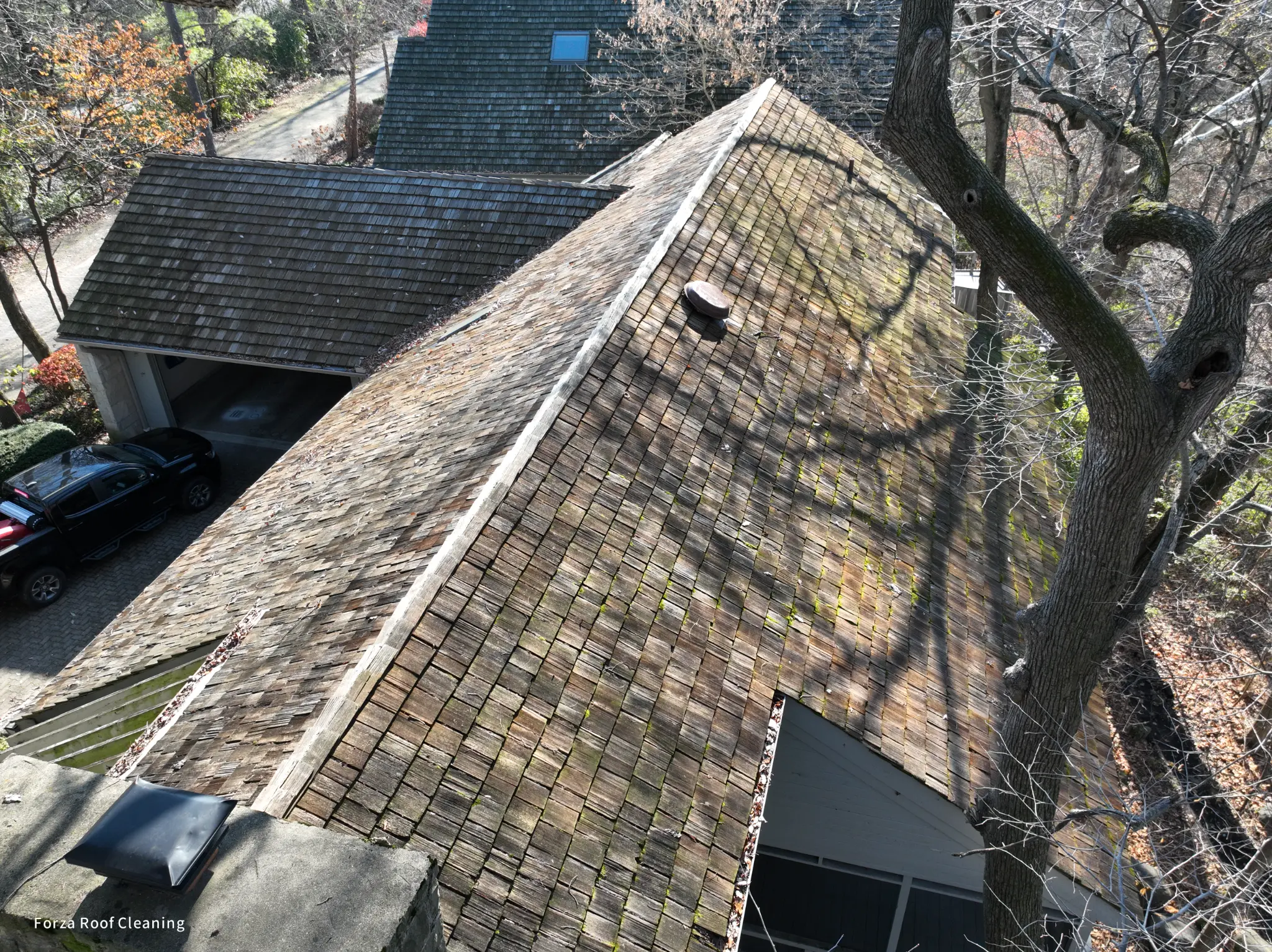 Before cedar roof cleaning - dark moss and algae on Dublin cedar shake roof