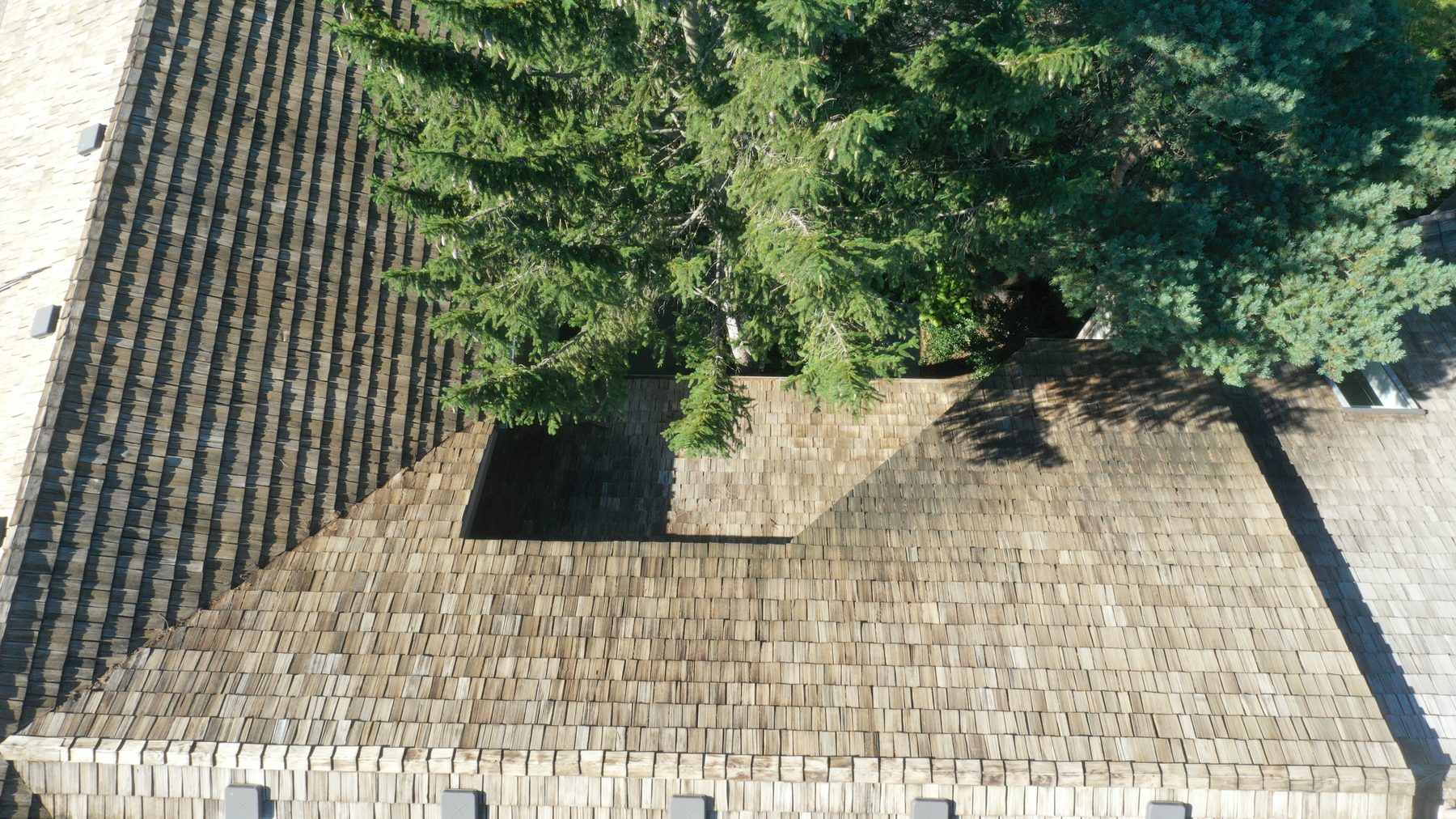 After cedar roof cleaning - close-up of roof detail with clean cedar shakes and clear valleys in Muirfield Village Dublin Ohio
