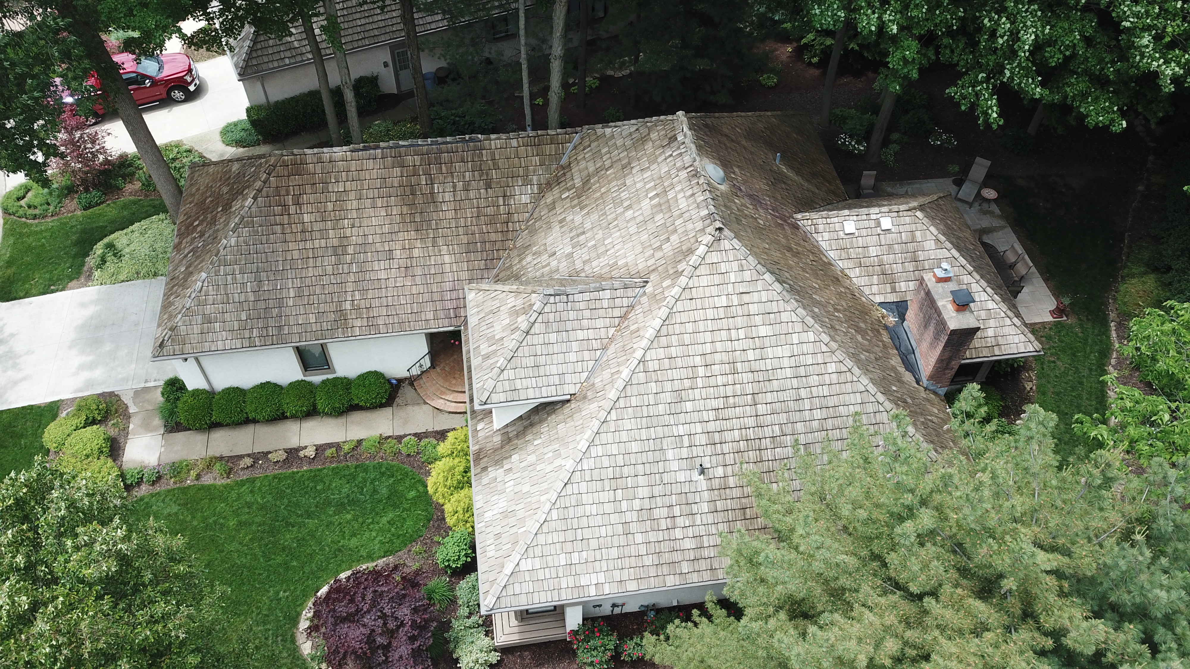 Cedar shake roof cleaning results - tree-canopy home in The Sanctuary Columbus