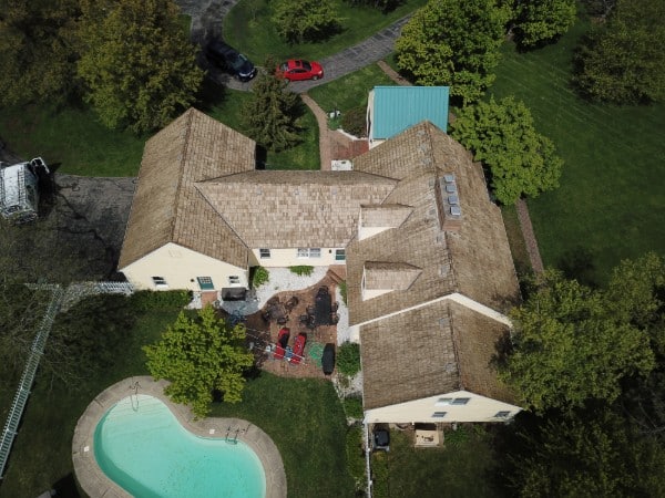 Cedar shake roof restored to natural wood color after Forza cleaning