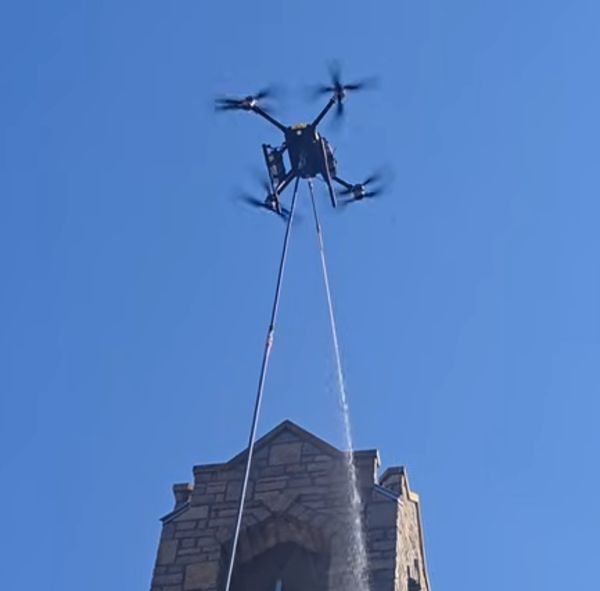 Drone spraying roof