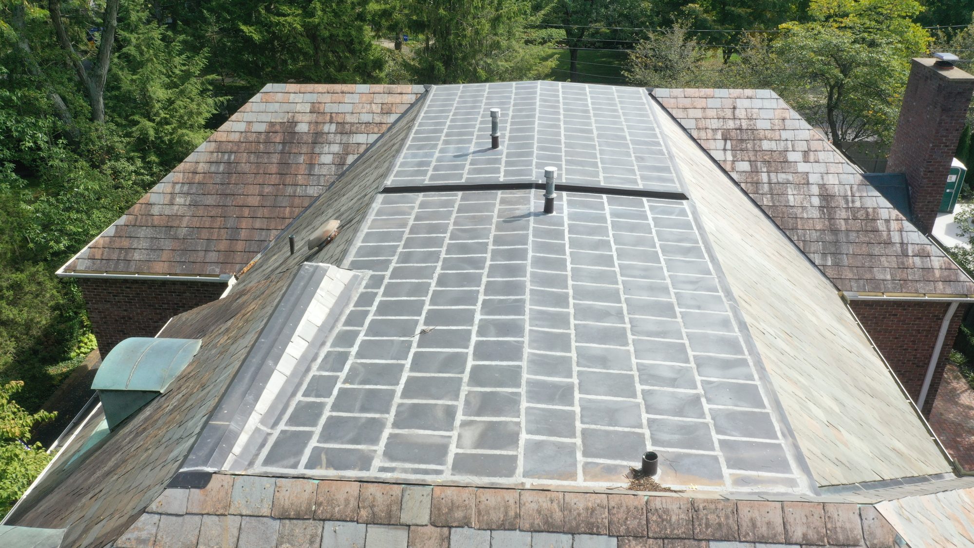Aerial view of Bexley Colonial slate roof with dark staining before cleaning