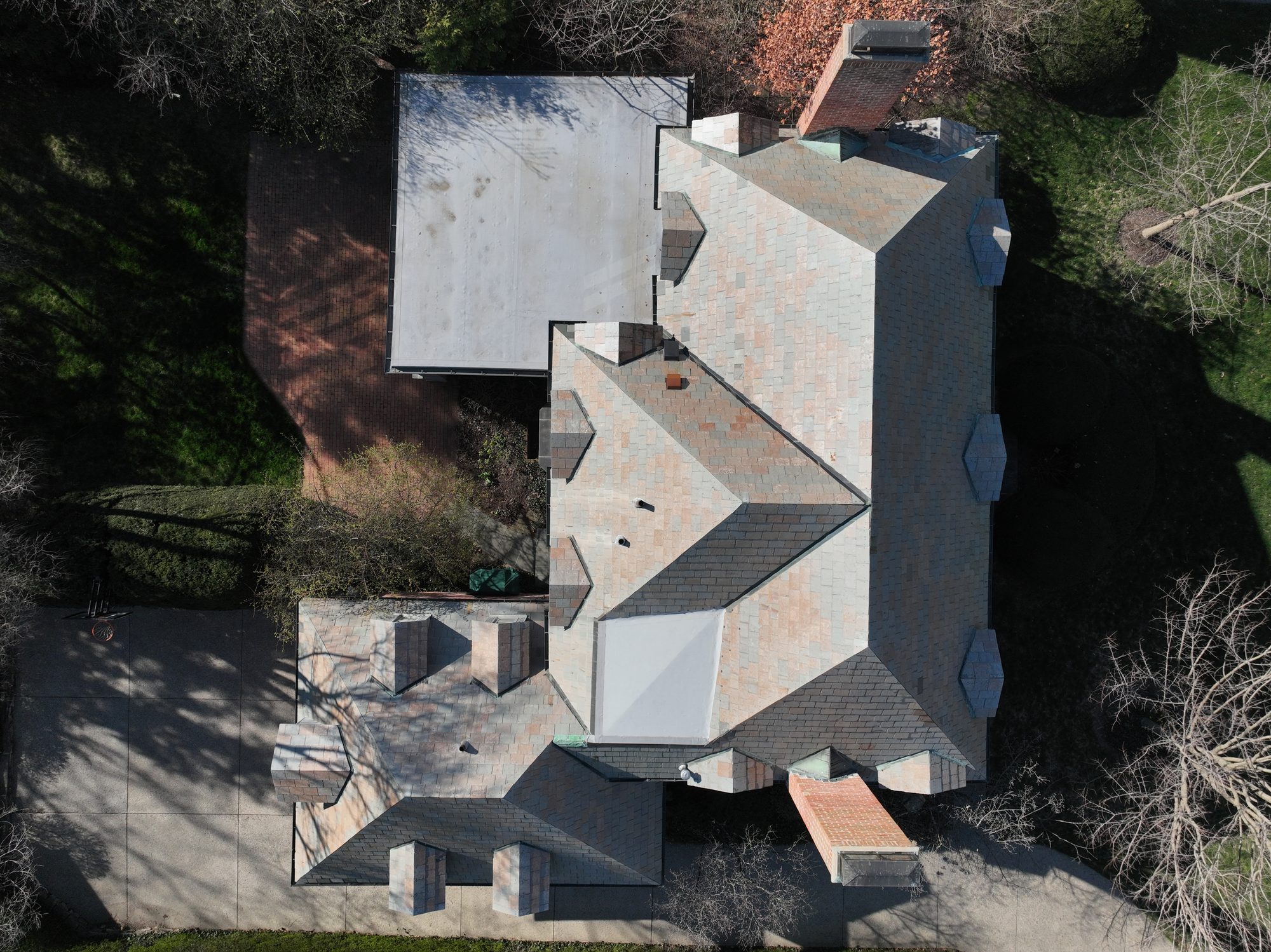 Rear gables of Bexley slate roof after professional cleaning by Forza Roof Cleaning