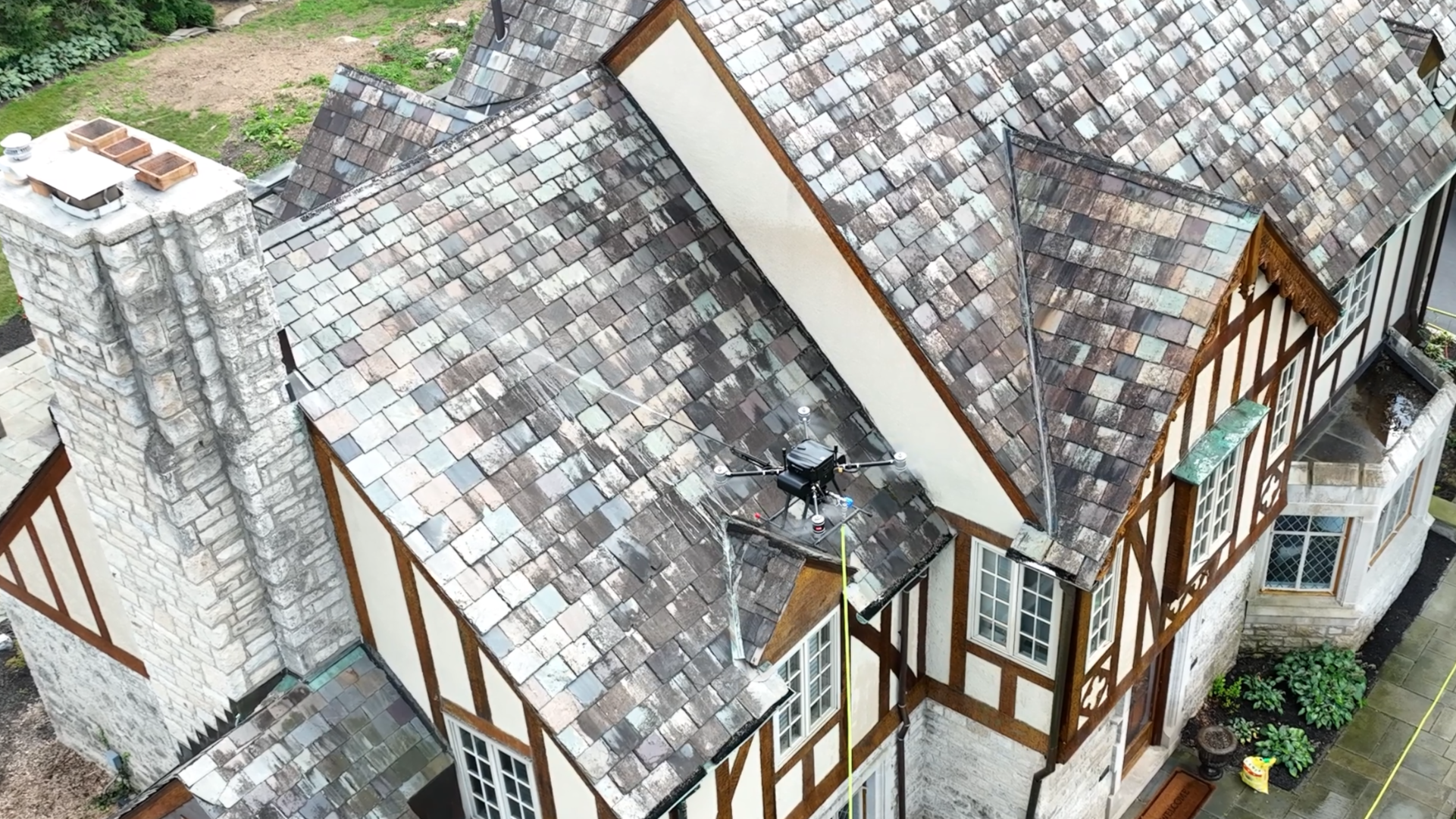 Drone cleaning a slate roof in Powell