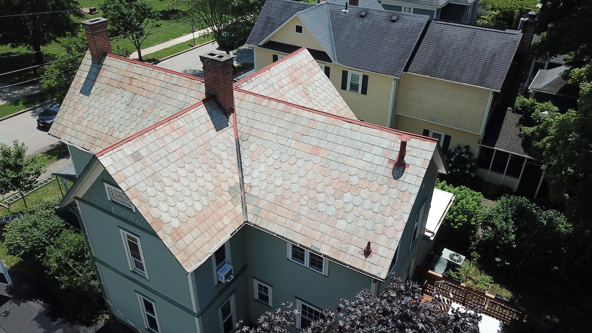 After roof cleaning in Granville Ohio — restored natural pink and terracotta slate tiles