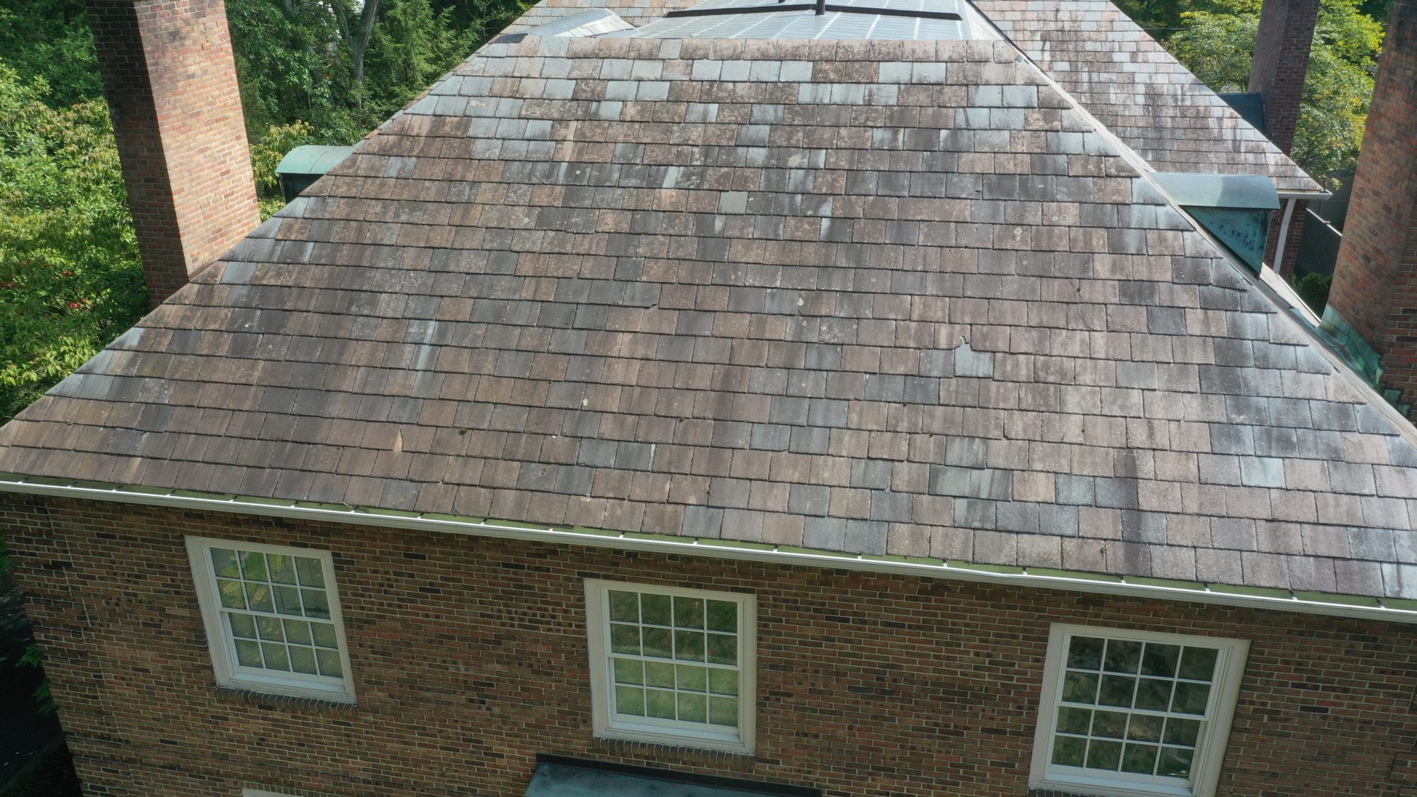 Brick Colonial slate roof in Bexley before cleaning showing moderate algae staining
