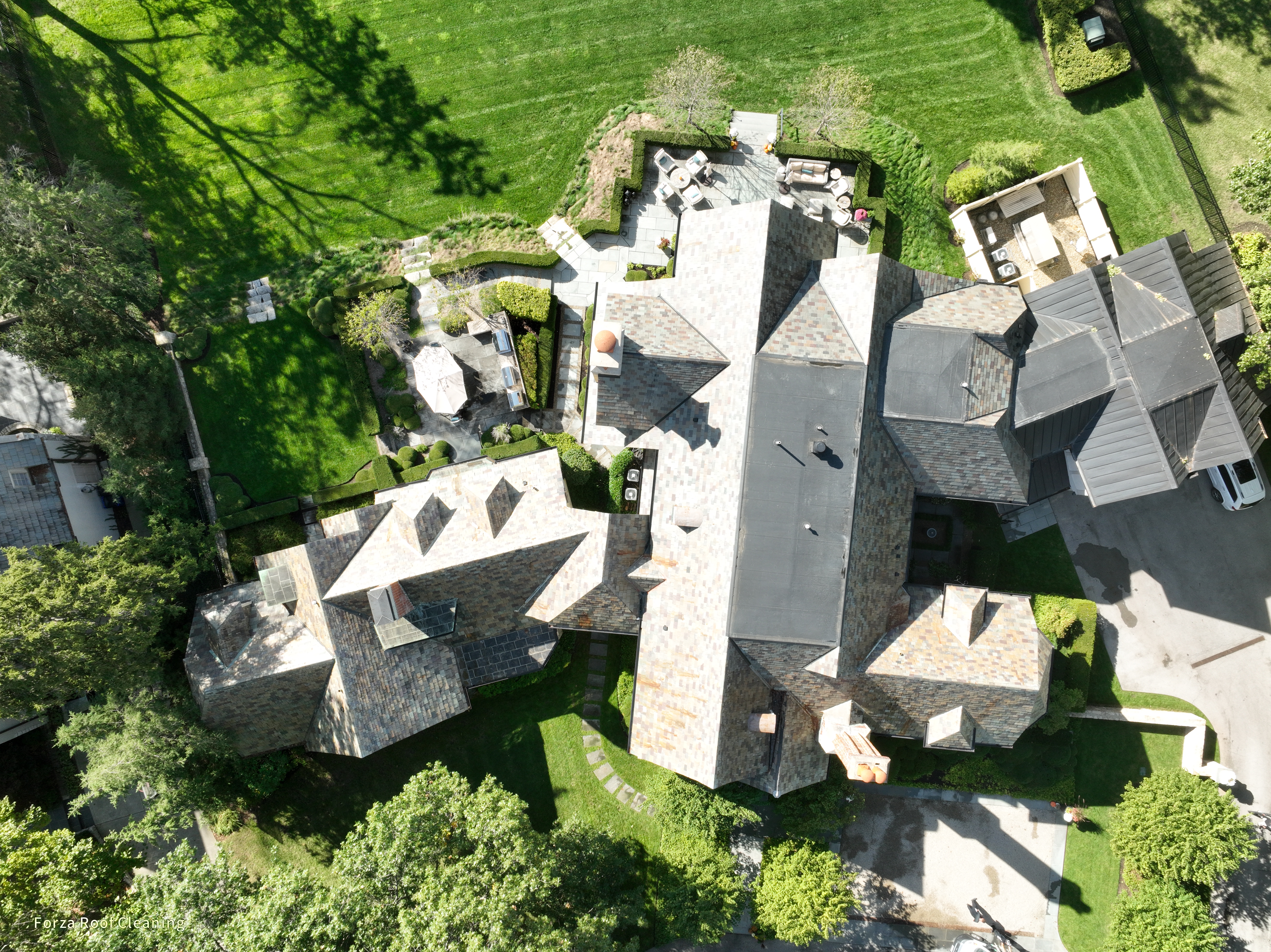 After slate roof cleaning - restored natural slate colors on Upper Arlington estate