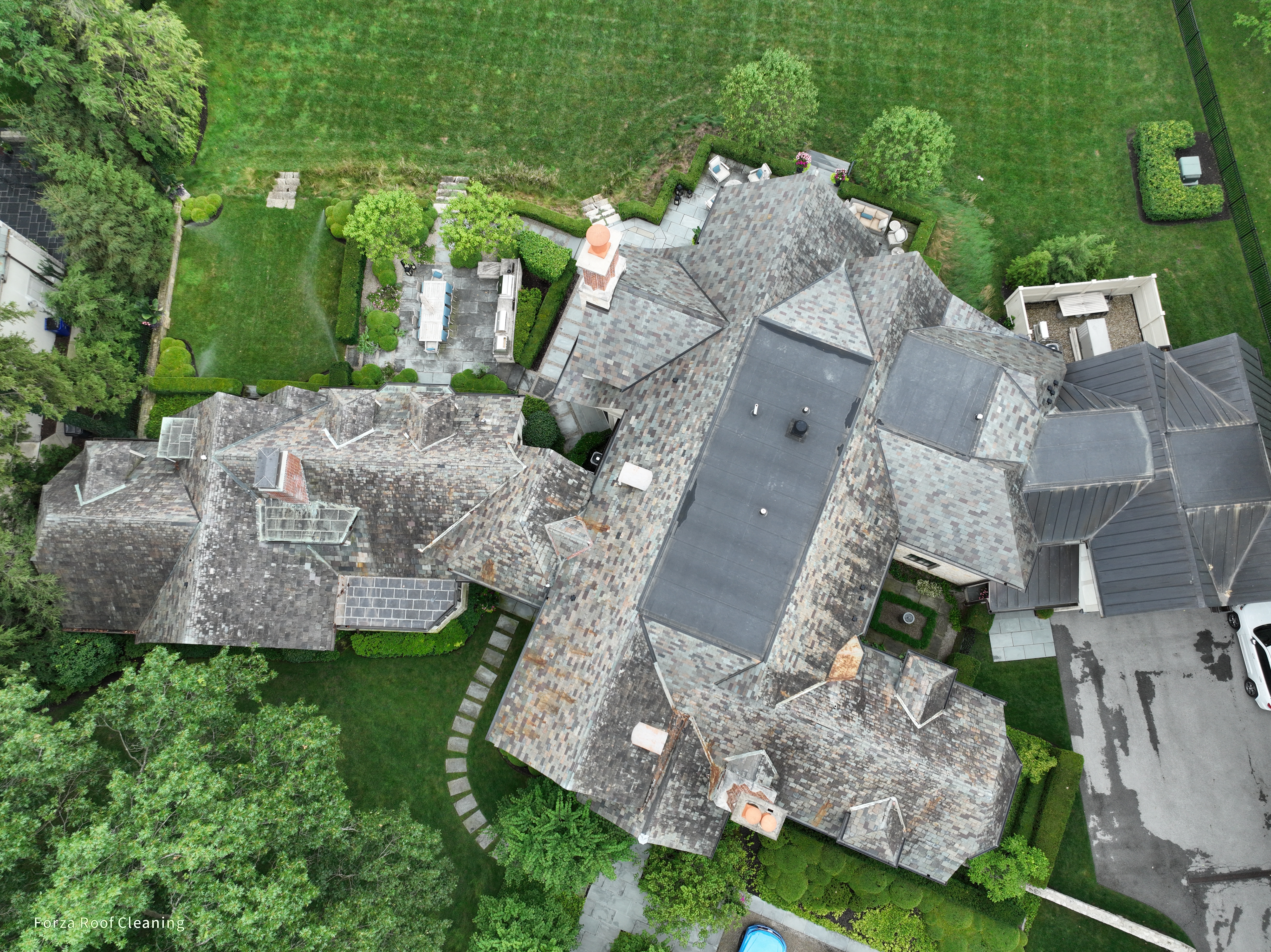 Before slate roof cleaning - dark staining and algae on Upper Arlington estate slate roof